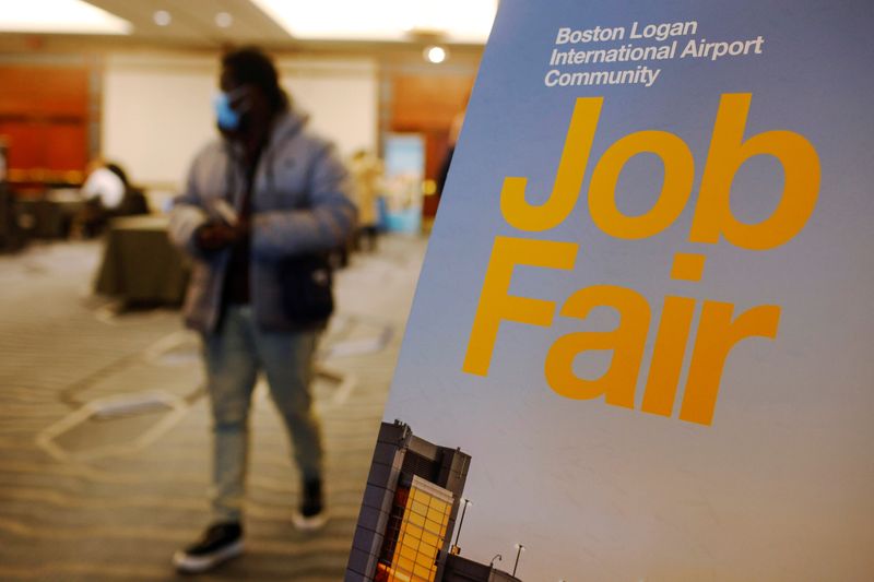 FILE PHOTO: A job seeker leaves the job fair for airport related employment at Logan International Airport in Boston, Massachusetts, U.S., December 7, 2021.   REUTERS/Brian Snyder/File Photo