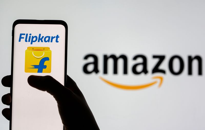 FILE PHOTO: Smartphone with Flipkart logo is seen in front of displayed Amazon logo in this illustration taken, July 30, 2021. REUTERS/Dado Ruvic/Illustration/File Photo