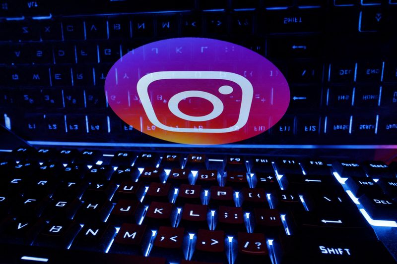 FILE PHOTO: A keyboard is placed in front of a displayed Instagram logo in this illustration taken February 21, 2023. REUTERS/Dado Ruvic/Illustration/File Photo
