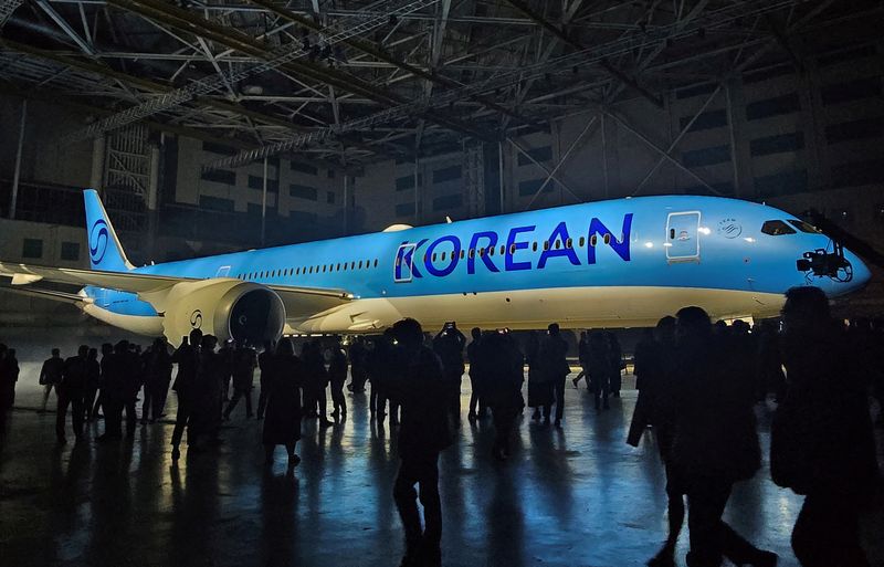 FILE PHOTO: The new logo of Korean Air is seen on its plane during an event in Gimpo, South Korea, March 11, 2025.   REUTERS/Dogyun Kim/File Photo