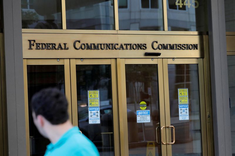 FILE PHOTO: Signage is seen at the headquarters of the Federal Communications Commission in Washington, D.C., U.S., August 29, 2020. REUTERS/Andrew Kelly/File Photo