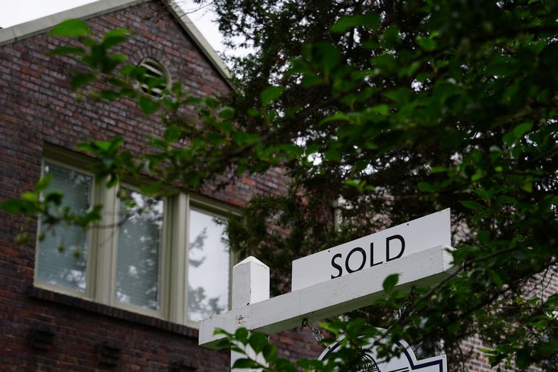 A "sold" sign is seen outside of a recently purchased home in Washington, U.S., July 7, 2022. REUTERS/Sarah Silbiger