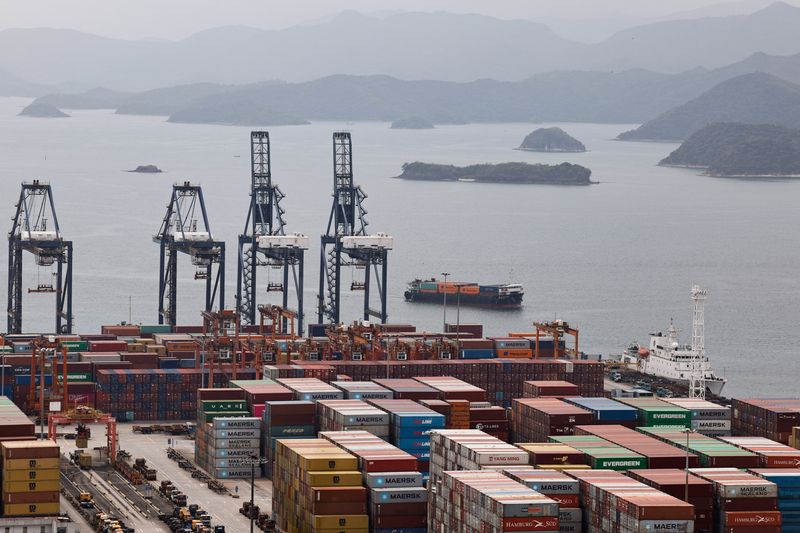 A cargo ship carrying containers approaches towards the Yantian port in Shenzhen, Guangdong province, China April 17, 2025. REUTERS/Tingshu Wang/File Photo