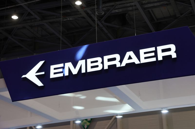 FILE PHOTO: An Embraer logo is pictured during the European Business Aviation Convention & Exhibition (EBACE) in Geneva, Switzerland, May 23, 2022. REUTERS/Denis Balibouse/File Photo