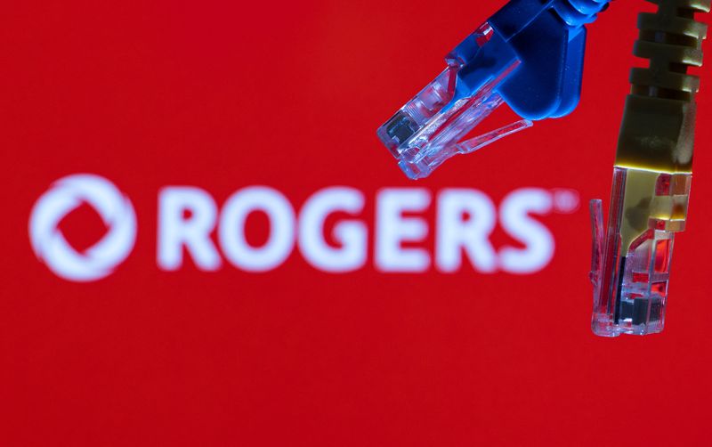FILE PHOTO: Ethernet cables are seen in front of Rogers Communications logo in this illustration taken, July 8, 2022. REUTERS/Dado Ruvic/Illustrations/File Photo