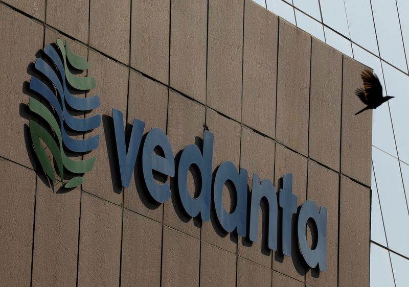 FILE PHOTO: A bird flies past the logo of Vedanta installed on the facade of its headquarters in Mumbai, India January 31, 2018. REUTERS/Danish Siddiqui//File Photo