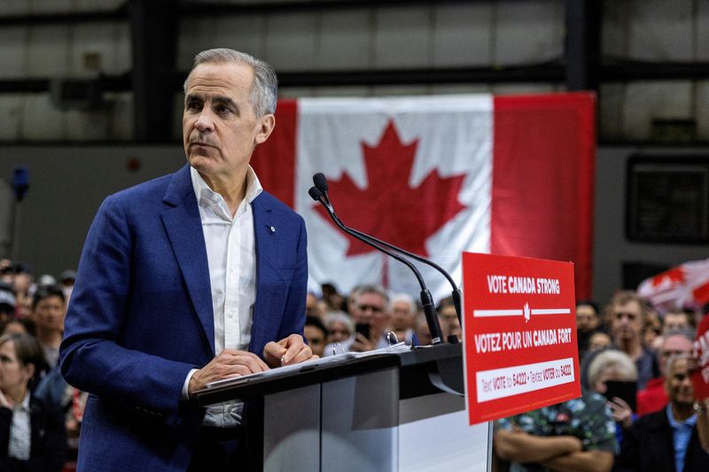 Canada's Prime Minister Mark Carney looks on as he delivers remarks at the Cloverdale Agriplex venue during a rally of his Liberal Party election campaign tour in Surrey, British Columbia, Canada April 23, 2025. REUTERS/Carlos Osorio/File Photo