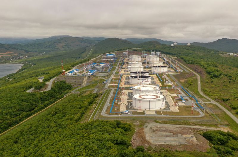 FILE PHOTO: An aerial view shows oil tanks of Transneft oil pipeline operator at the crude oil terminal Kozmino on the shore of Nakhodka Bay near the port city of Nakhodka, Russia June 13, 2022. Picture taken with a drone. REUTERS/Tatiana Meel/File Photo
