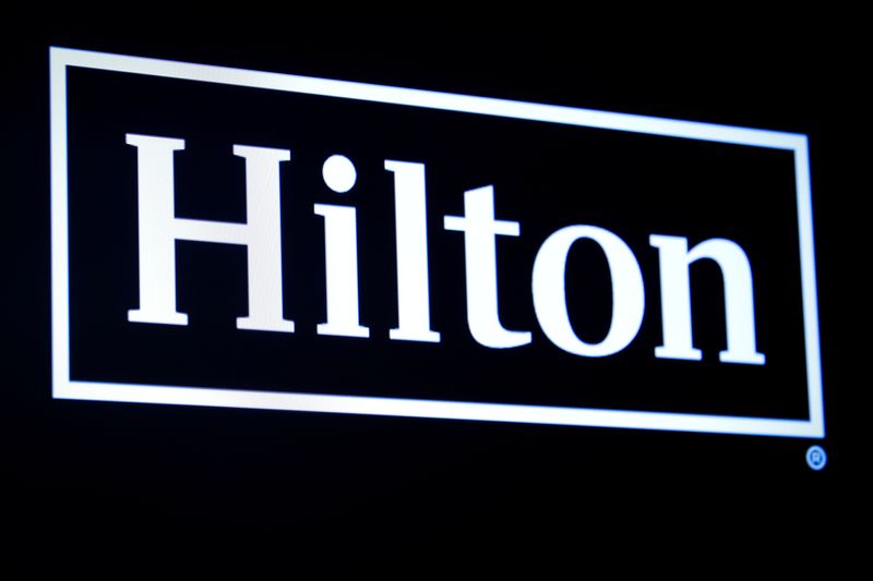 FILE PHOTO: The Hilton logo is displayed on a screen on the floor of the New York Stock Exchange (NYSE) in New York, U.S., May 29, 2019. REUTERS/Brendan McDermid/File photo