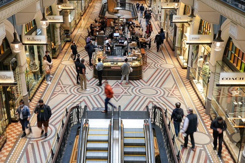 FILE PHOTO: People walk through a shopping mall in Sydney, Australia, October 12, 2021.  REUTERS/Loren Elliott/File Photo