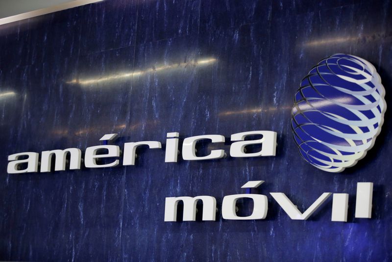 FILE PHOTO: The logo of America Movil is pictured on the wall at a reception area in the company's corporate offices, in Mexico City, Mexico January 25, 2022. REUTERS/Gustavo Graf/File photo