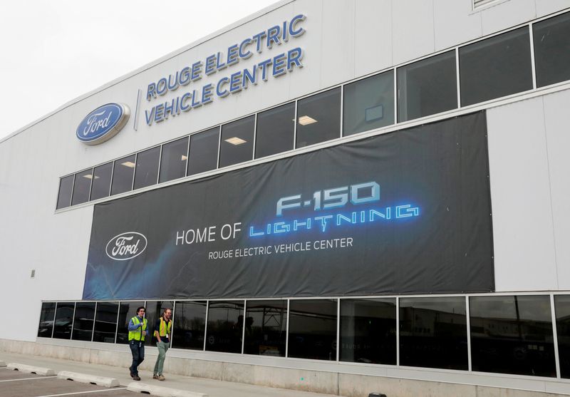 FILE PHOTO: A banner for the all-new Ford F-150 Lightning electric pickup truck is seen outside the Rouge Electric Vehicle Center in Dearborn, Michigan, U.S., April 26, 2022. REUTERS/ Rebecca Cook/File Photo