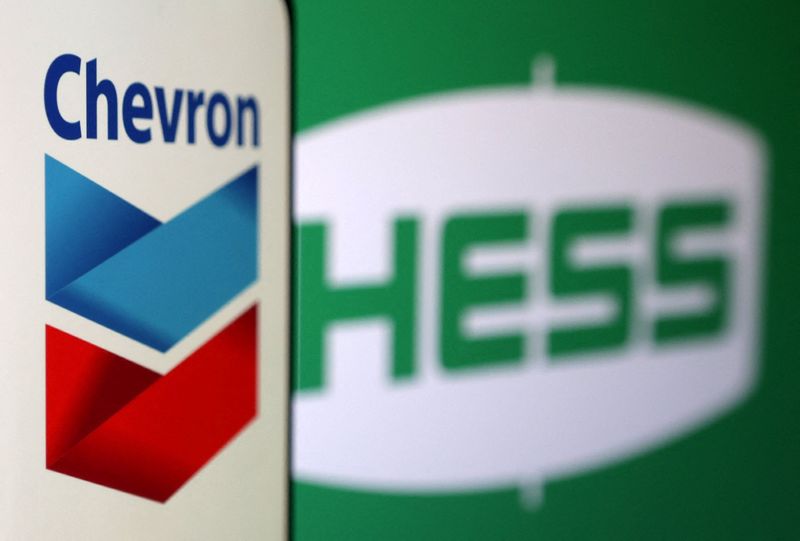 Chevron and Hess logos are seen in this illustration taken, October 23, 2023. REUTERS/Dado Ruvic/Illustration