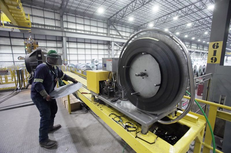 FILE PHOTO: An employee works inside a Nucor steel factory in Blytheville, Arkansas, U.S., March 28, 2025.  REUTERS/Karen Pulfer Focht/File photo