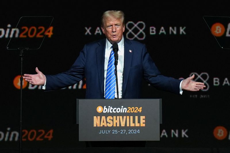 FILE PHOTO: Republican presidential nominee and former U.S. President Donald Trump gestures at the Bitcoin 2024 event in Nashville, Tennessee, U.S., July 27, 2024. REUTERS/Kevin Wurm/File Photo