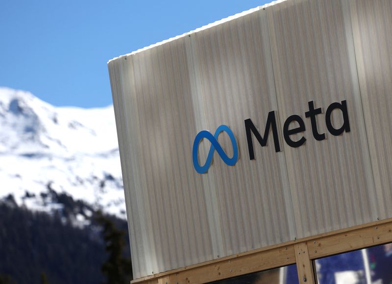 FILE PHOTO: The logo of Meta is seen at the entrance of the company's temporary stand ahead of the World Economic Forum (WEF) in Davos, Switzerland January 18, 2025. REUTERS/Yves Herman/File Photo