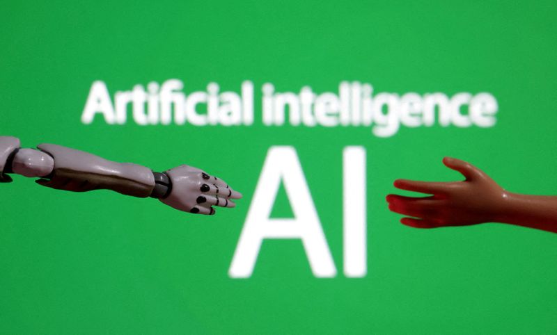 FILE PHOTO: Words reading "Artificial intelligence AI", miniature of robot and toy hand are pictured in this illustration taken December 14, 2023. REUTERS/Dado Ruvic/Illustration/File Photo
