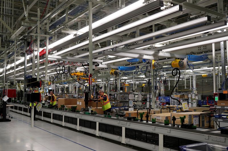 FILE PHOTO: Volvo employees work in the final assembly building at the first U.S. production plant in Ridgeville, South Carolina, U.S., June 20, 2018. REUTERS/Randall Hill/File Photo