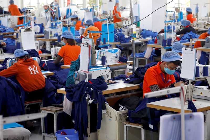 FILE PHOTO: Labourers work at Hung Viet garment export factory in Hung Yen province, Vietnam December 30, 2020. REUTERS/Kham/File Photo