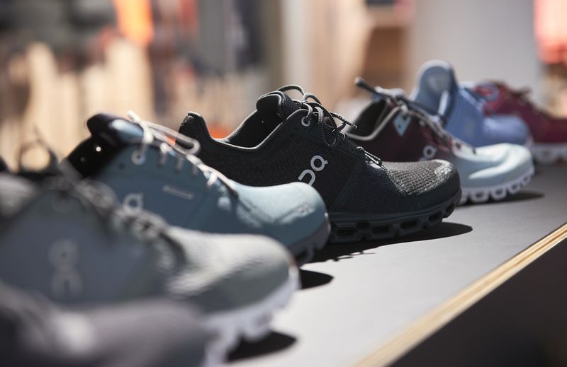 FILE PHOTO: Shoes by ON (Run on Clouds), a shoemaker backed by Swiss tennis player Roger Federer, are pictured in the Swiss Sport Style shop ahead of the Initial Public Offering (IPO), in Lausanne, Switzerland, September 14, 2021. REUTERS/Denis Balibouse/File photo