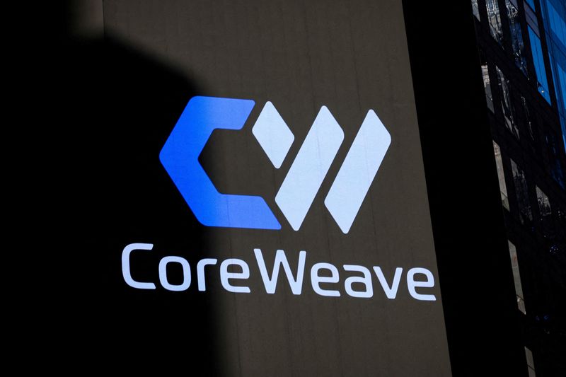 FILE PHOTO: A screen displays the company logo for CoreWeave, Inc., Nvidia-backed cloud services provider, during the company's IPO at the Nasdaq Market, in New York City, U.S., March 28, 2025. REUTERS/Brendan McDermid/File Photo