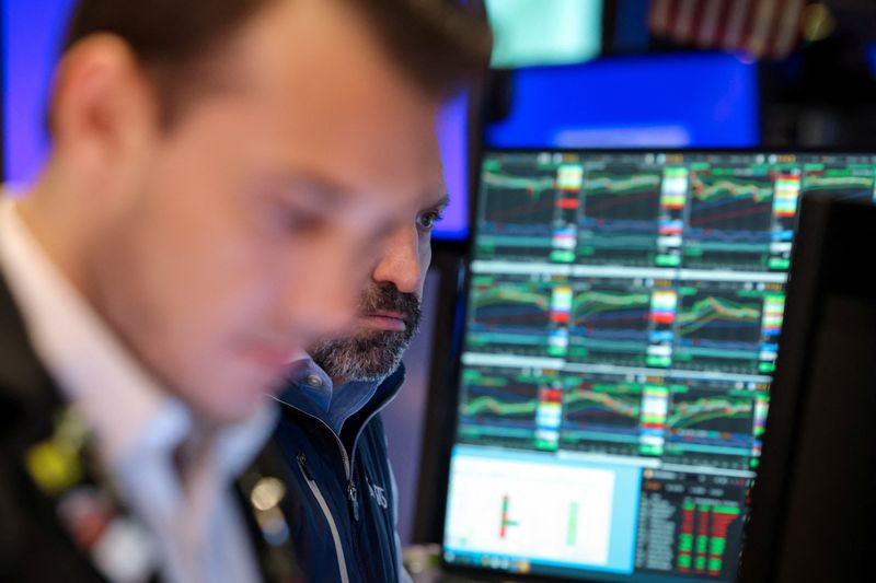 Traders work on the floor at the New York Stock Exchange (NYSE) in New York City, U.S., May 13, 2025.  REUTERS/Brendan McDermid
