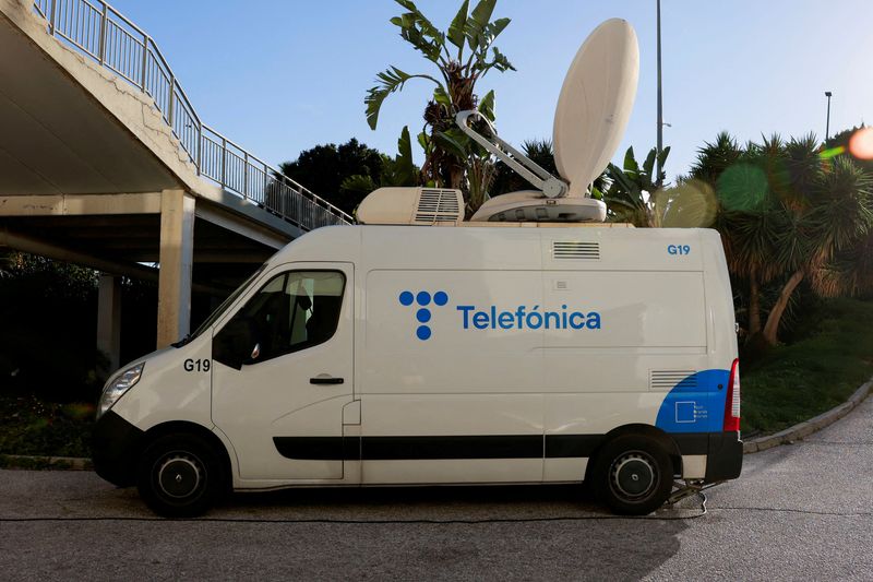 FILE PHOTO: The logo of Spanish Telecom company Telefonica is seen on a satellite transmission van, in Malaga, Spain