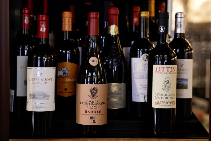 FILE PHOTO: Bottles of Italian wine are stored in a fridge inside the wine shop Kabb in Rome, Italy, March 14, 2025. REUTERS/Remo Casilli/File Photo