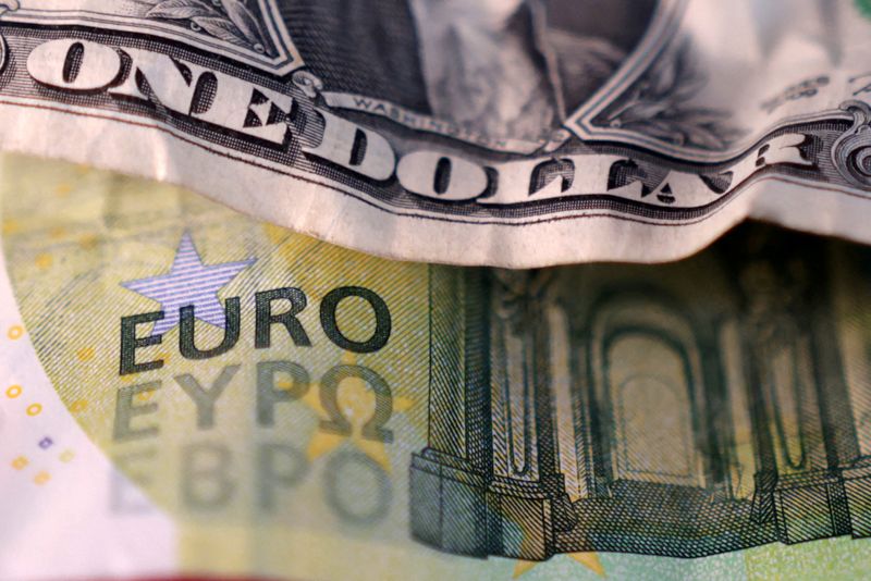 FILE PHOTO: U.S. dollar and Euro banknotes are seen in this illustration taken March 19, 2025. REUTERS/Dado Ruvic/Illustration/File Photo