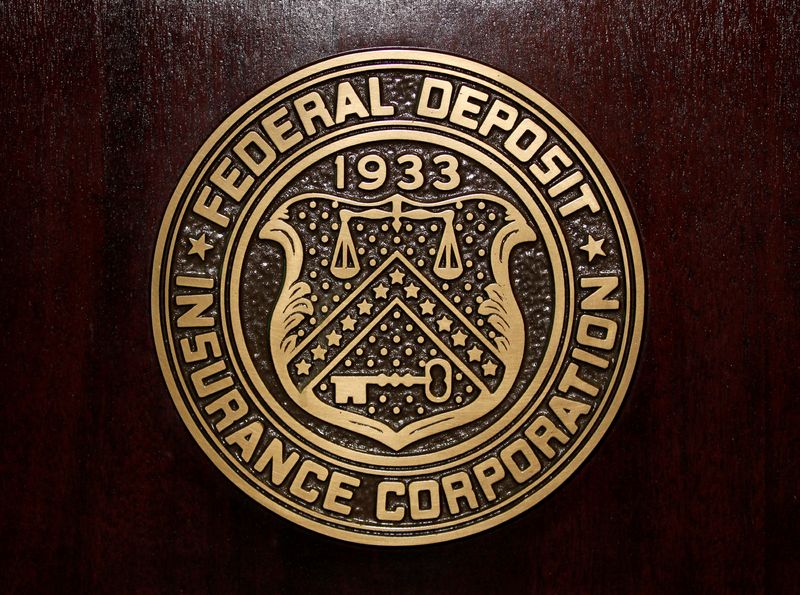 FILE PHOTO: The Federal Deposit Insurance Corp (FDIC) logo is seen at the FDIC headquarters as Chairman Sheila Bair announces the bank and thrift industry earnings for the fourth quarter 2010, in Washington, February 23, 2011.    REUTERS/Jason Reed/File Photo