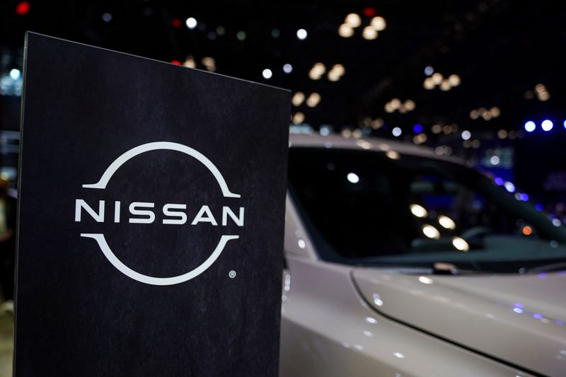 FILE PHOTO: A Nissan logo is seen next to a vehicle during the New York International Auto Show, in Manhattan, New York City, U.S., April 5, 2023. REUTERS/David 'Dee' Delgado/File Photo