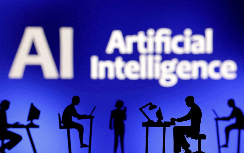 FILE PHOTO: Figurines with computers and smartphones are seen in front of the words "Artificial Intelligence AI" in this illustration taken, February 19, 2024. REUTERS/Dado Ruvic/Illustratio/File Photo