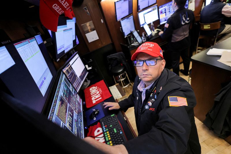 FILE PHOTO: A trader wears a hat in support of Republican Donald Trump, after he won the U.S. presidential election, at the New York Stock Exchange (NYSE) in New York City, U.S., November 6, 2024. REUTERS/Andrew Kelly/File Photo