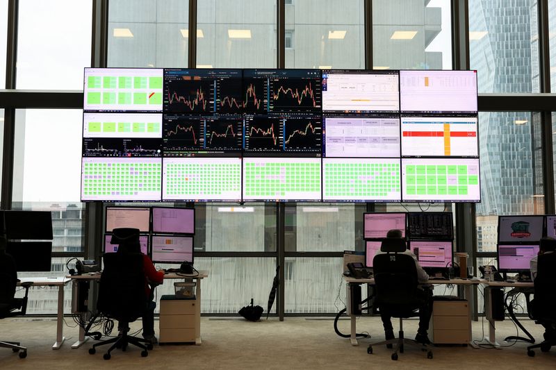 FILE PHOTO: People work at the trading floor of the Euronext stock exchange in the La Defense business district in Paris, France, March 10, 2025. REUTERS/Benoit Tessier/File Photo