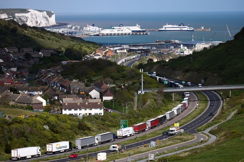 FILE PHOTO: Freight lorries queue to enter the Port of Dover on the A20 road outside of Dover, Britain, April 27, 2022. REUTERS/Henry Nicholls/File Photo
