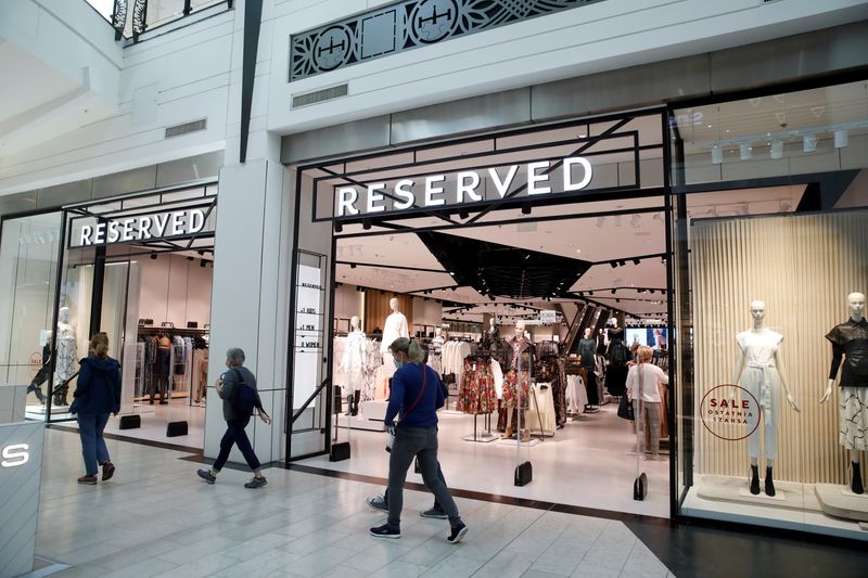 FILE PHOTO: People walk outside a Polish fashion retailer LPP brand Reserved shop, amid the coronavirus disease (COVID-19), in Warsaw, Poland, September 4, 2020. Picture taken September 4, 2020. REUTERS/Kacper Pempel/File Photo