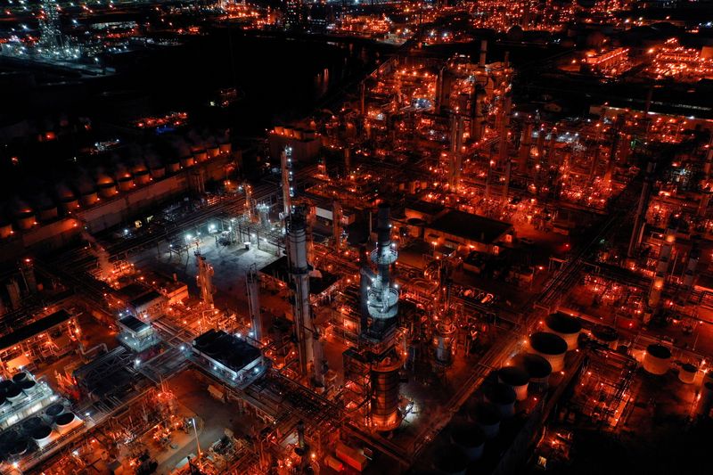 FILE PHOTO: A nighttime view of Marathon Petroleum's Los Angeles Refinery, which processes domestic & imported crude oil into gasoline, diesel fuel, and other refined petroleum products, in Carson, California, U.S., March 11, 2022. Picture taken with a drone. REUTERS/Bing Guan/File Photo