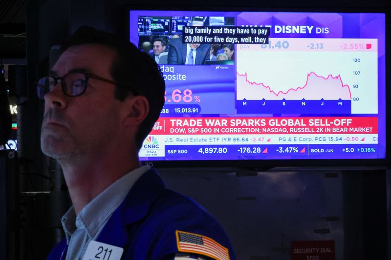 A trader works on the floor at the New York Stock Exchange (NYSE) in New York City, U.S., April 7, 2025.  REUTERS/Brendan McDermid/File Photo
