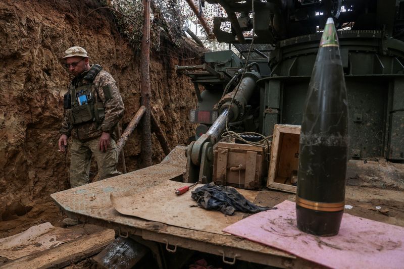 FILE PHOTO: A Ukrainian serviceman of the 100th Separate Mechanized Brigade walks next to a Bohdana self-propelled howitzer at a position on a front line near the town of Toretsk, amid Russia's attack on Ukraine, in Donetsk region, Ukraine April 7, 2025. REUTERS/Oleksandr Ratushniak/File Photo