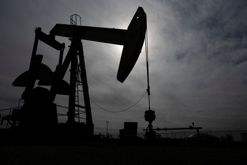 FILE PHOTO: A pump jack operates near a crude oil reserve in the Permian Basin oil field near Midland, Texas, U.S. February 18, 2025.  REUTERS/Eli Hartman/File photo