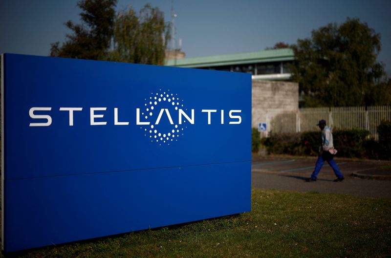 A man walks past a logo of Stellantis outside the company's building in Chartres-de-Bretagne near Rennes, France, September 20, 2024. REUTERS/Stephane Mahe/File Photo