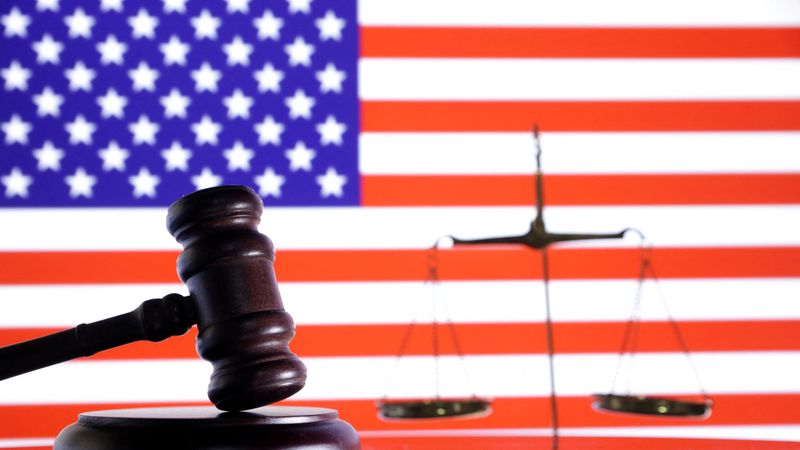 The U.S. flag, a judge gavel and a vintage scale are seen in this illustration taken August 6, 2024. REUTERS/Dado Ruvic/Illustration/File Photo