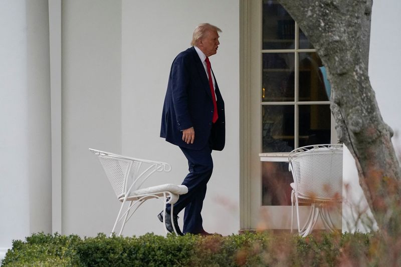 U.S. President Donald Trump arrives to the White House following his visit to the Department of Justice to address its workers, in Washington, D.C., U.S., March 14, 2025. REUTERS/Nathan Howard/File Photo