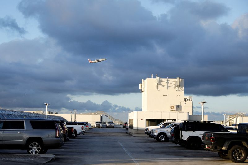 An American Airlines plane takes off from Miami International Airport after the Federal Aviation Administration (FAA) said it had slowed the volume of airplane traffic over Florida due to an air traffic computer issue, in Miami, Florida, U.S. January 2, 2023.  REUTERS/Marco Bello/File Photo
