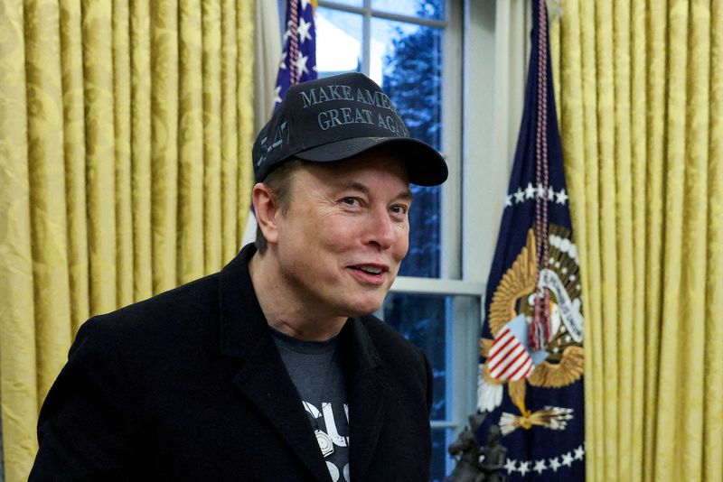 FILE PHOTO: Elon Musk speaks next to U.S. President Donald Trump (not pictured) in the Oval Office of the White House in Washington, D.C., U.S., February 11, 2025.   REUTERS/Kevin Lamarque//File Photo