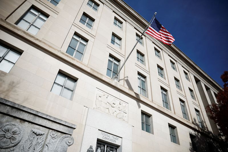 A U.S. flag flutters at the Federal Trade Commission (FTC) headquarters in Washington, D.C., U.S., November 24, 2024. REUTERS/Benoit Tessier/File Photo