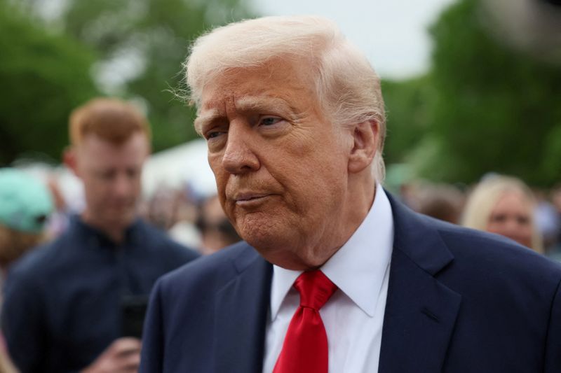 FILE PHOTO: U.S. President Donald Trump attends the annual White House Easter Egg Roll, on the South Lawn of the White House in Washington, D.C., U.S., April 21, 2025. REUTERS/Leah Millis/File Photo