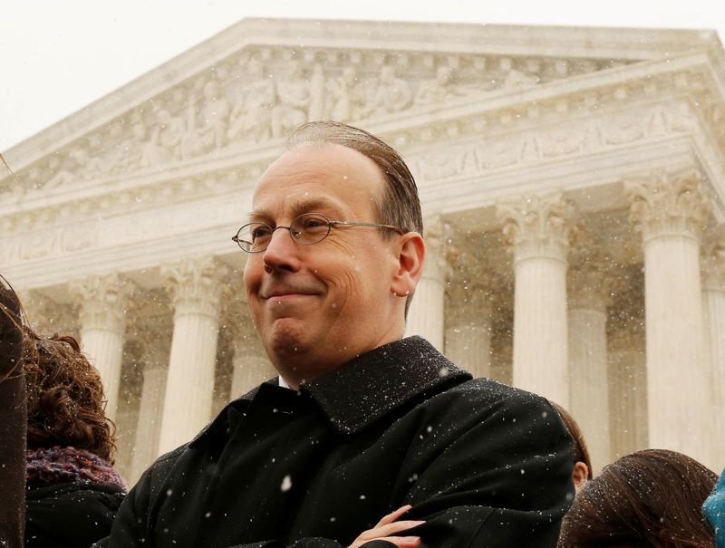 FILE PHOTO: Attorney Paul Clement waits to talk to the press standing on the steps of the Supreme Court in Washington, March 25, 2014.      REUTERS/Larry Downing/File Photo
