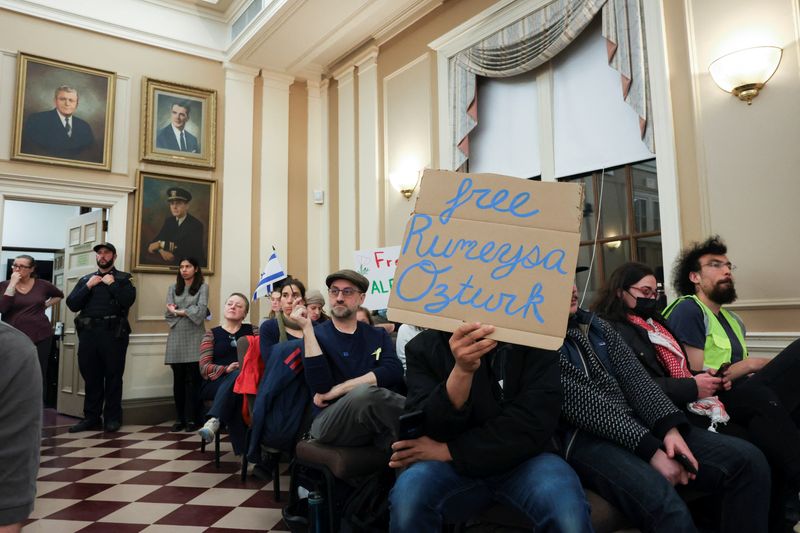 Demonstrators attend a city council meeting after Tufts PhD student Rumeysa Ozturk was taken into custody by federal agents, in Somerville, Massachusetts, U.S. March 27, 2025. REUTERS/Reba Saldanha/File Photo