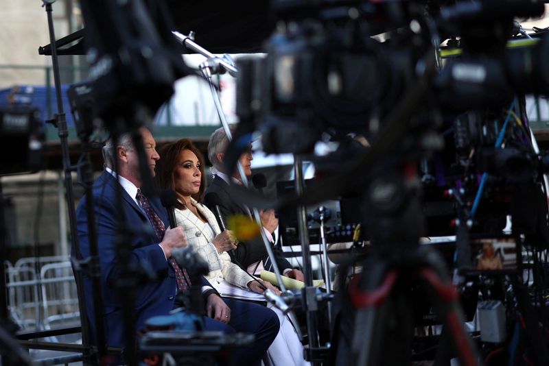 FILE PHOTO: Fox News Channel host Jeanine Pirro and other members of the news media work outside the Manhattan Criminal Court building during the 2nd day of jury deliberations in former U.S. President Donald Trump’s criminal trial over charges that he falsified business records to conceal money paid to silence porn star Stormy Daniels in 2016, in New York City, U.S. May 30, 2024. REUTERS/Mike Segar/File Photo